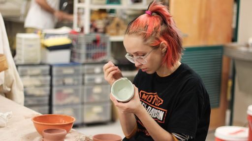 Pottery student at the Academy Center of the Arts